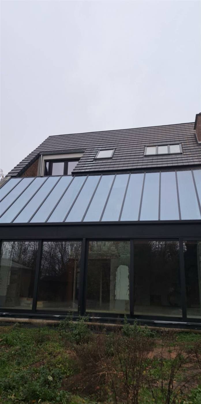 Extension avec toiture zinc et verrière